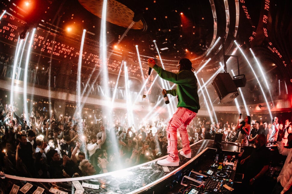 Lil Jon on DJ Booth with Champagne