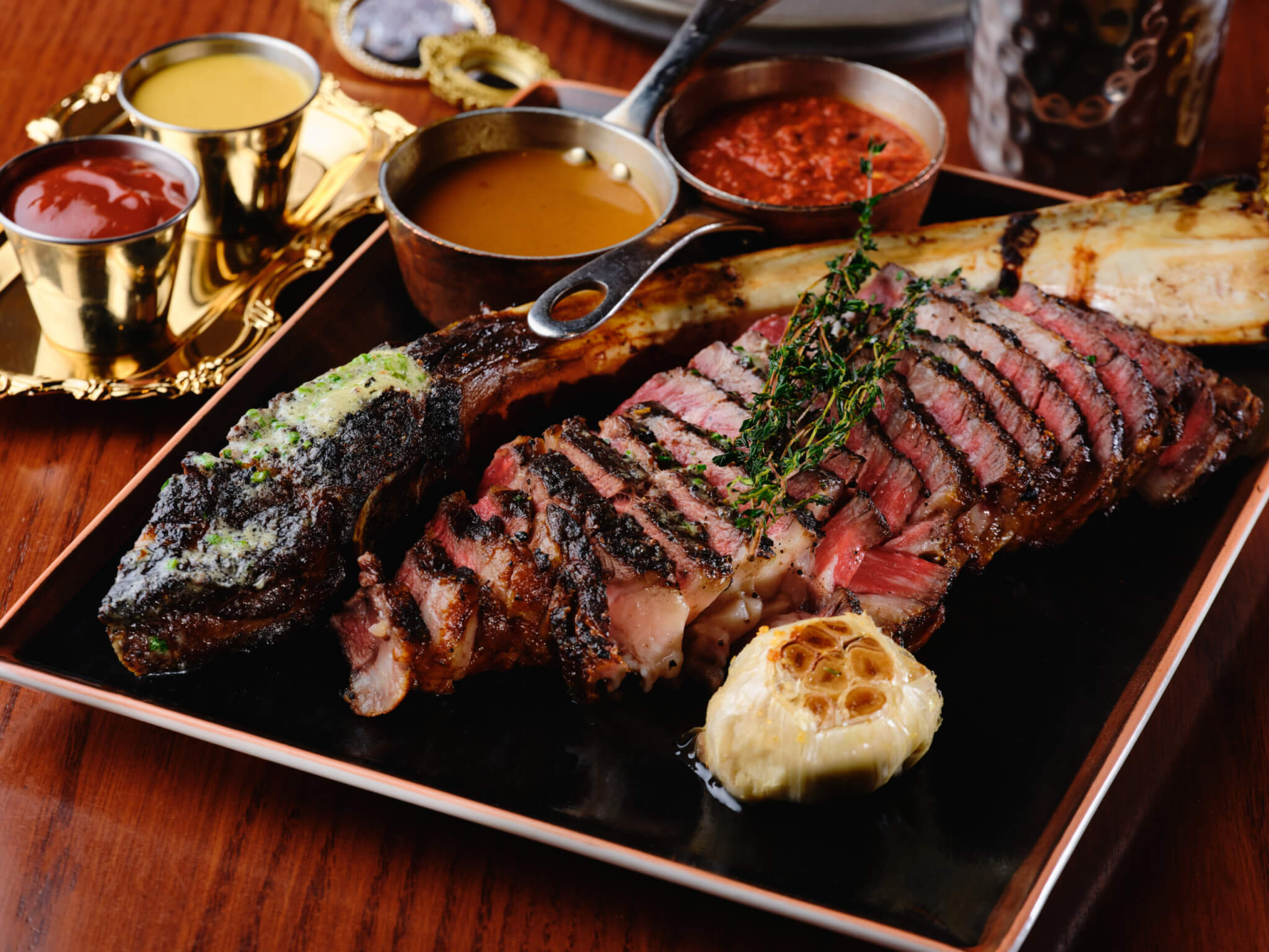 tomahawk steak with sauces at Beauty